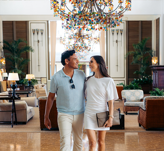 a couple walking in a hotel lobby